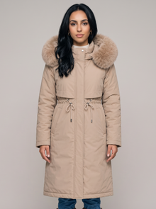 Women's beige long hooded winter coat with faux fur trim, front view