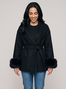 Women's black belted wool blend wrap coat with faux fur cuffs