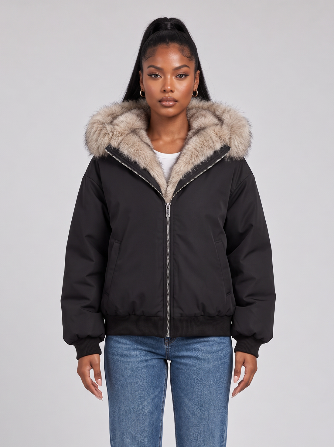 Women's black puffer jacket with faux fur trimmed hood, front view