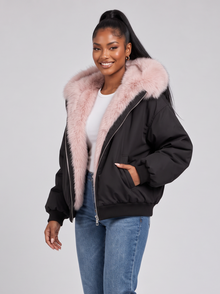Women's black puffer jacket with pale pink faux fur hood
