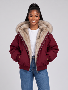 Women's dark red puffer jacket with faux fur hood