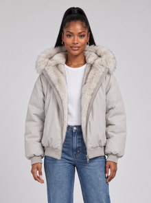 Women's silver grey puffer jacket with faux fur hood