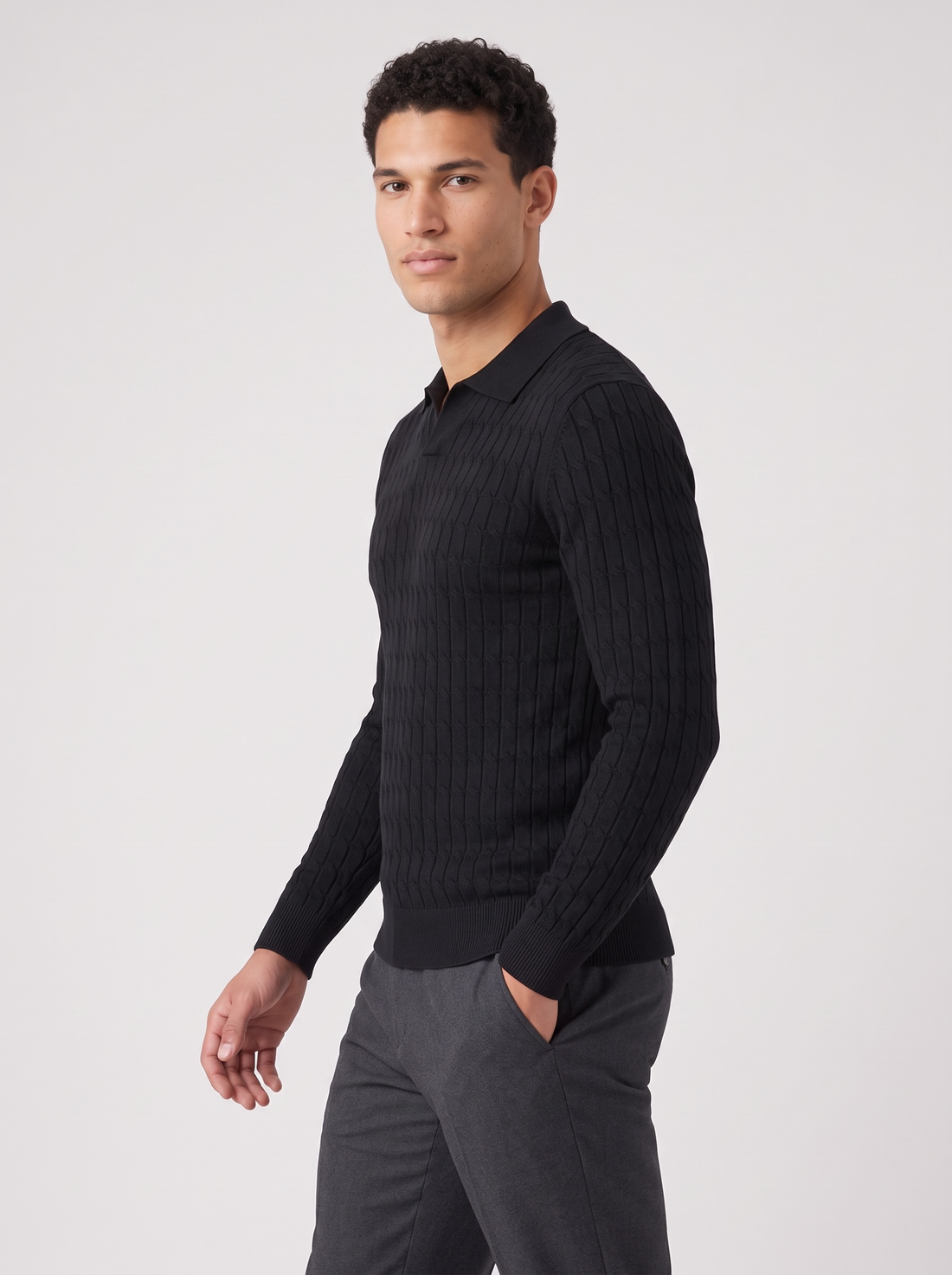 Men's black muscle fit knitted polo jumper, side view walking