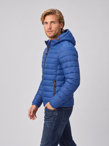 Men's blue quilted hooded puffer jacket, side view