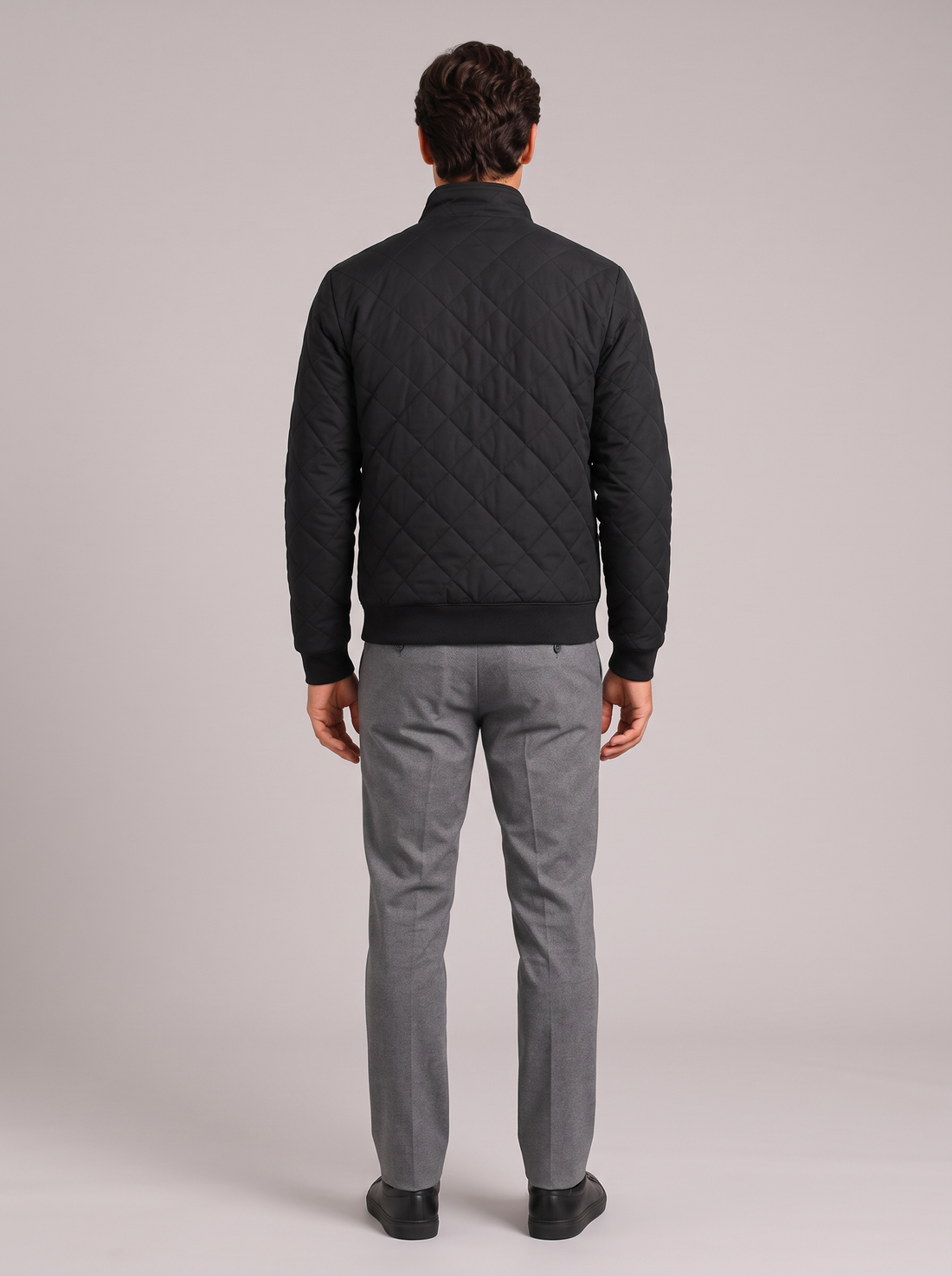 Men's black diamond-quilted zip jacket with stand collar, front view