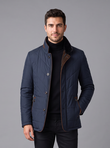 Man wearing navy quilted stand-collar jacket, front view