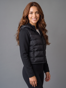 Side view of women's black lightweight zip puffer jacket