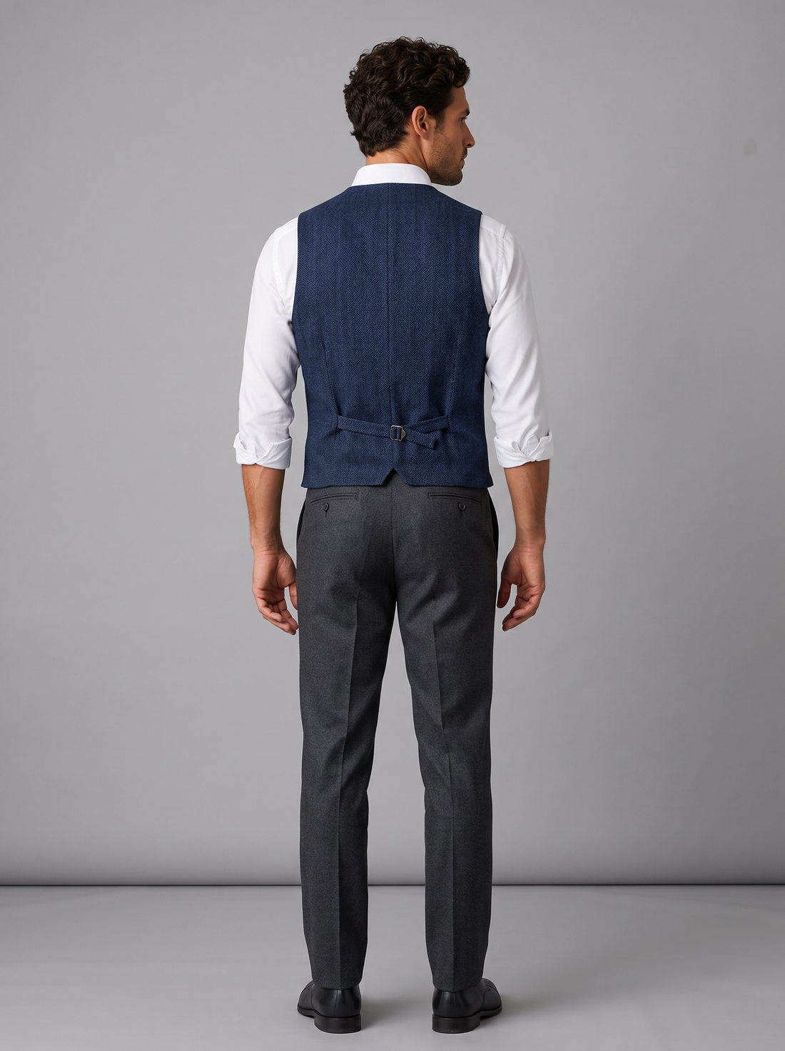 Man wearing navy herringbone tweed waistcoat, front view