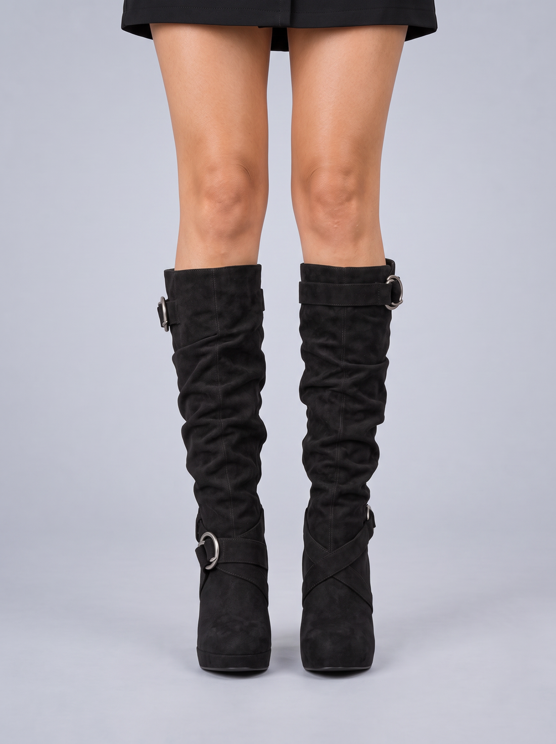 Black suede slouchy knee-high stiletto boots with ring buckles, front view