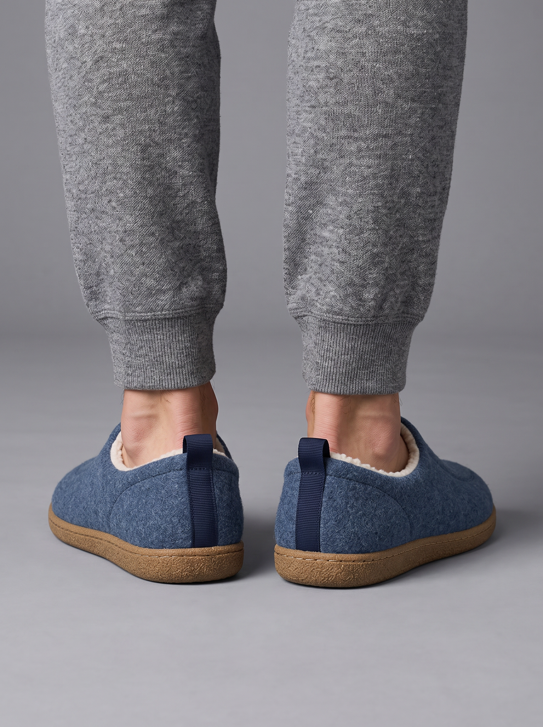 Blue fleece-lined house slippers – back view with heel tab