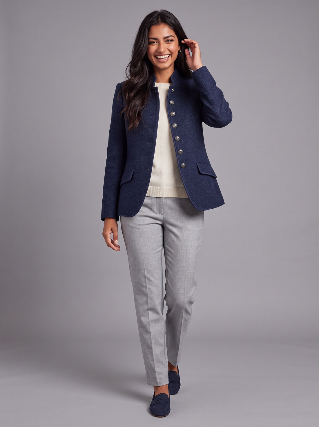 Women's navy wool-blend blazer with stand collar and metal buttons, walking