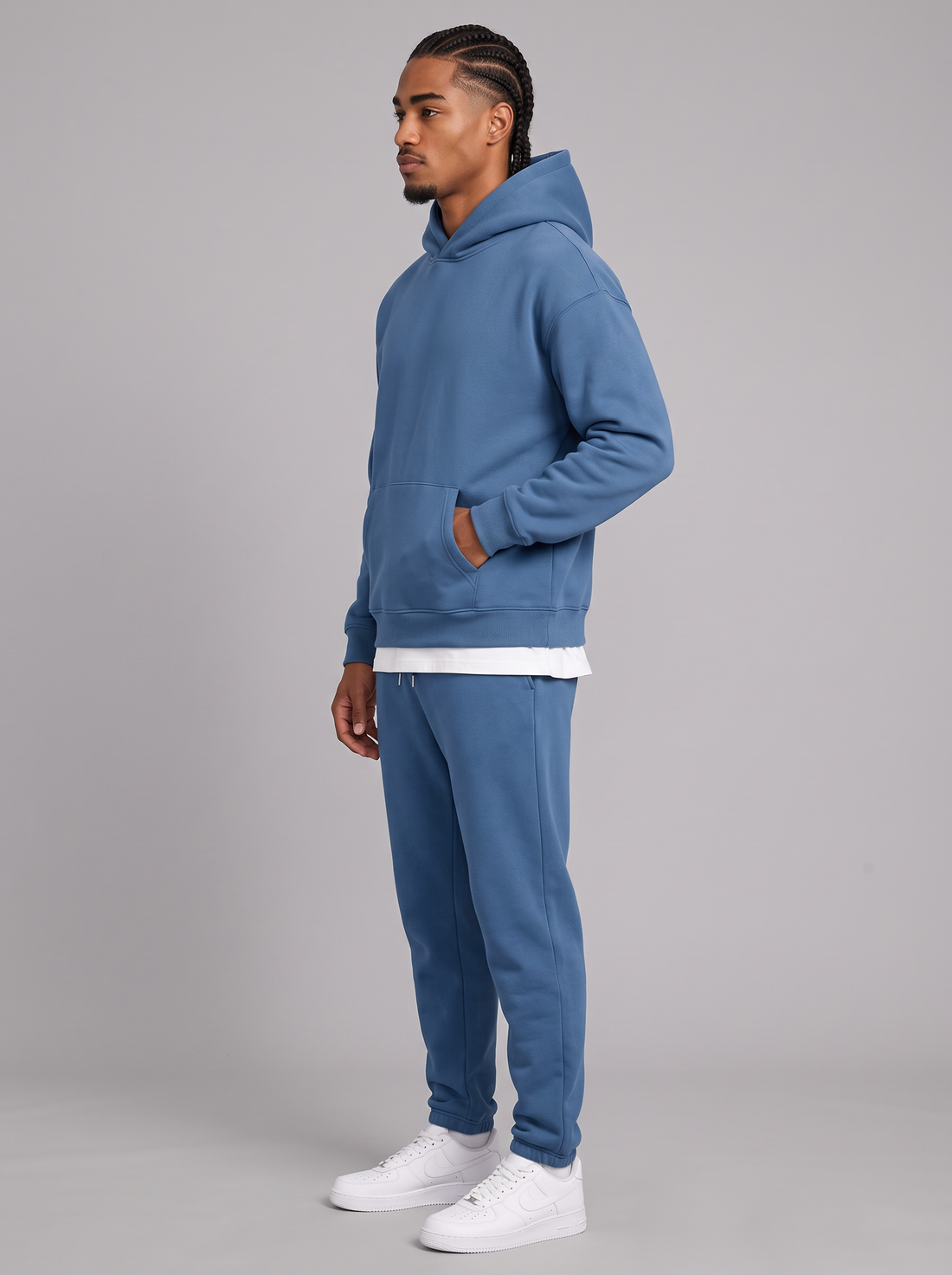 Men's blue oversized hoodie and tapered joggers tracksuit set, side view