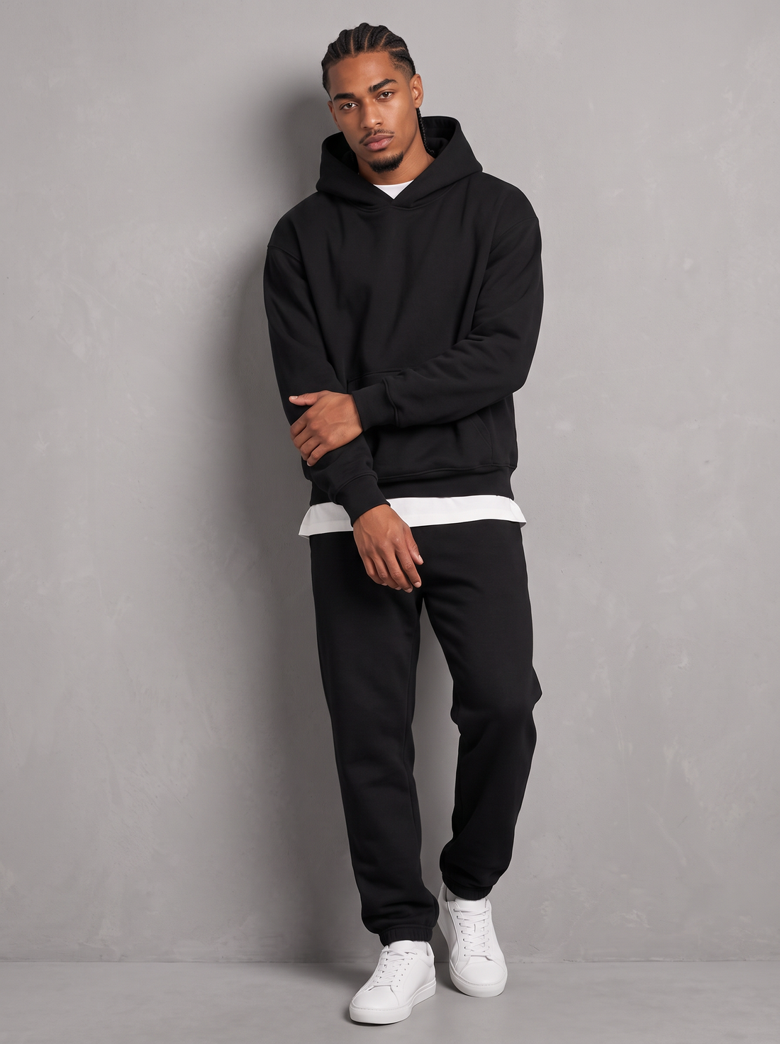 Men's black oversized hoodie and tapered joggers tracksuit set