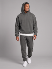 Men's dark grey oversized hoodie and tapered joggers tracksuit set