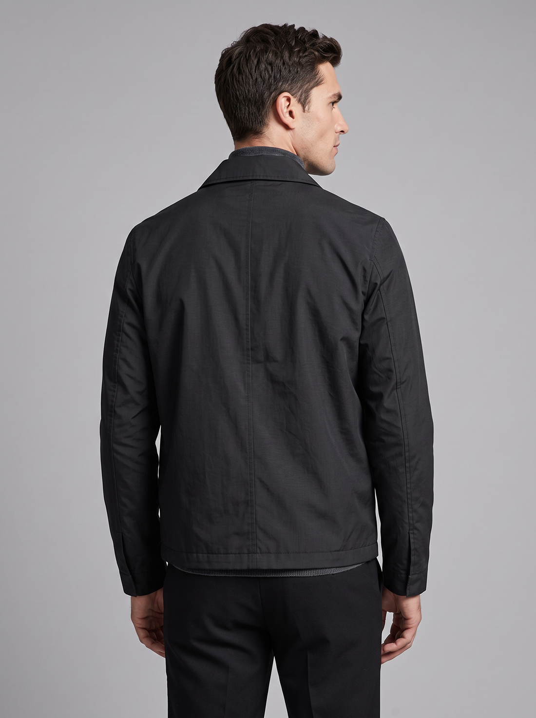 Men's black lightweight cotton-blend jacket worn open over a white shirt, front view