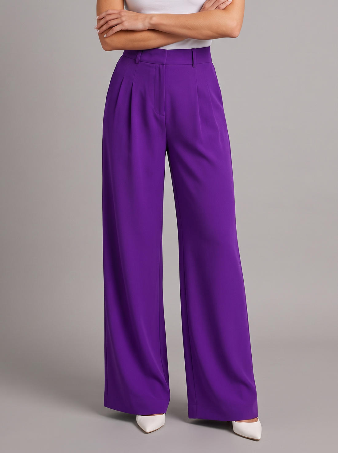 Woman wearing purple pleated wide leg trousers