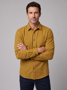 Man wearing a golden oak mustard flannel shirt