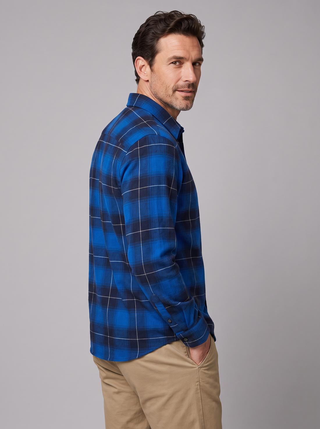 Man wearing a royal blue plaid flannel shirt