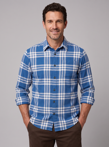 Man wearing a dark chambray blue plaid flannel shirt
