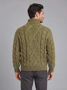 Back view of green cable knit roll neck jumper for men