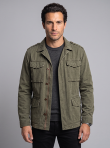 Man wearing olive green vintage military field jacket, front view