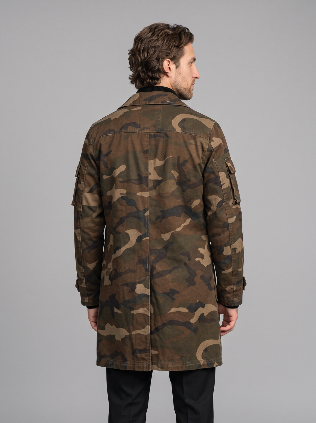 Man wearing brown camo cargo trench coat with flap chest pockets, front view