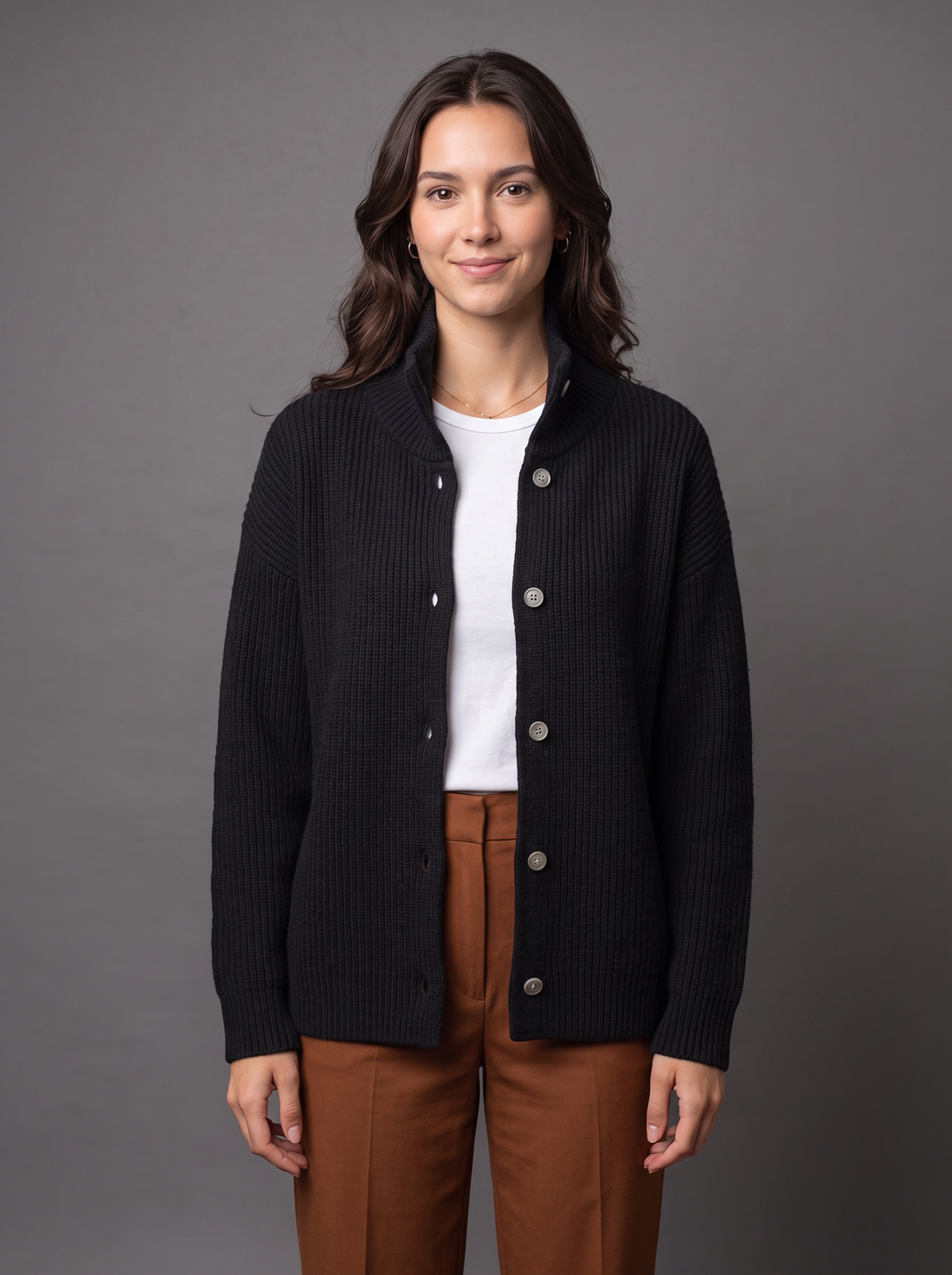 Woman wearing black wool cashmere knit cardigan with funnel collar
