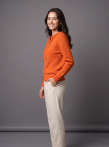 Orange knit zip hoodie cardigan, side view