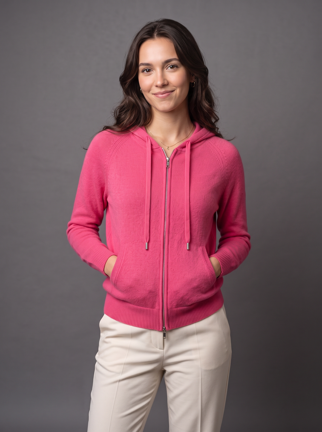 Woman wearing pink knit zip hoodie cardigan