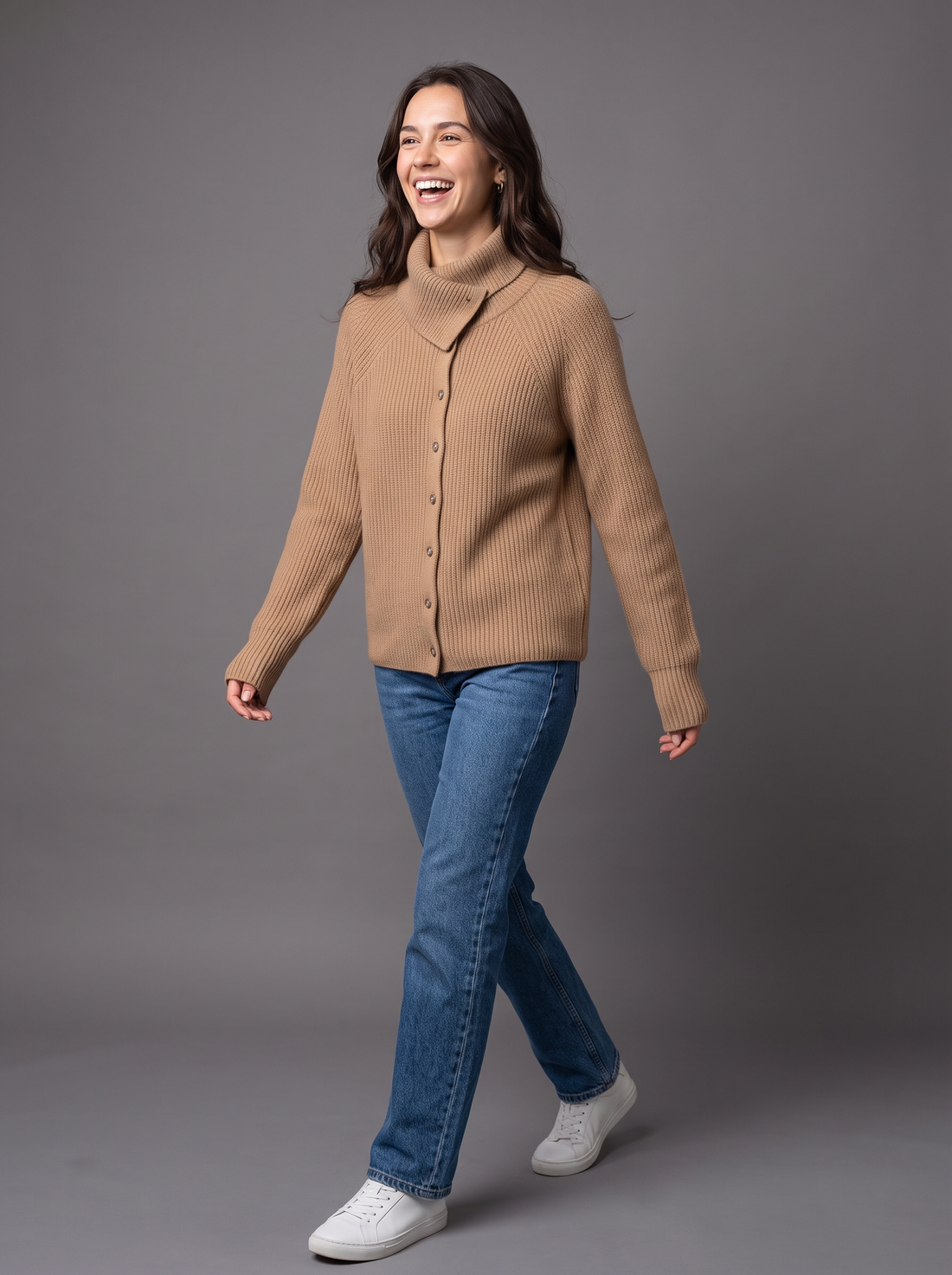 Woman walking in camel wool cashmere knit cardigan with jeans