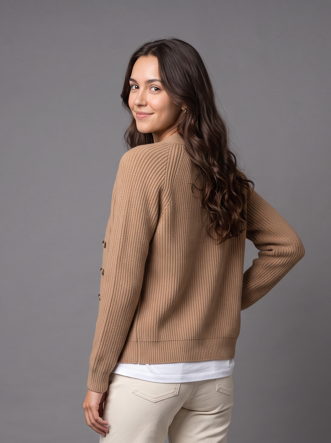 Woman wearing camel wool cashmere knit cardigan with funnel collar, front view