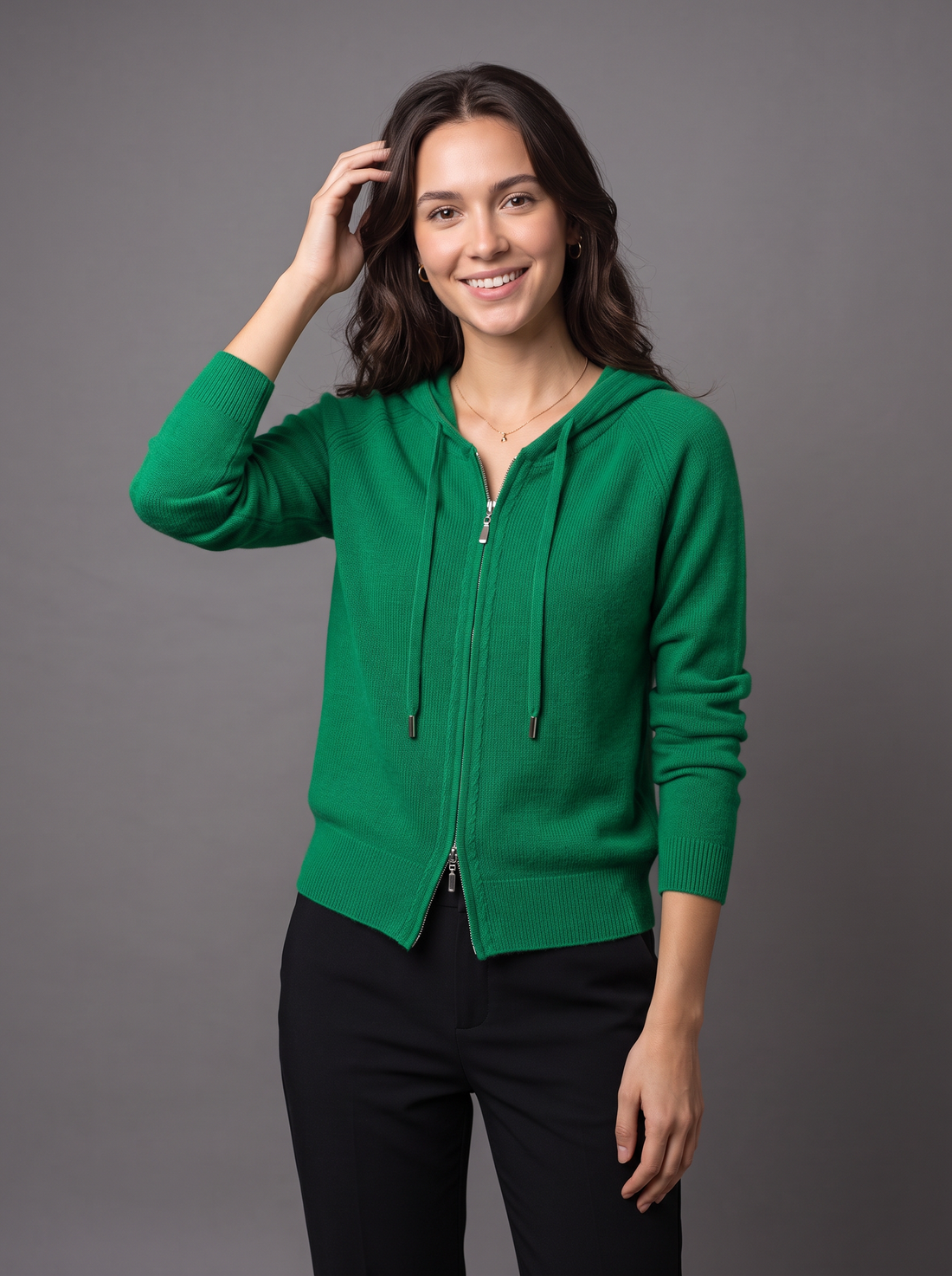 Woman wearing green knit zip hoodie cardigan