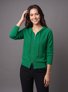 Woman wearing green knit zip hoodie cardigan
