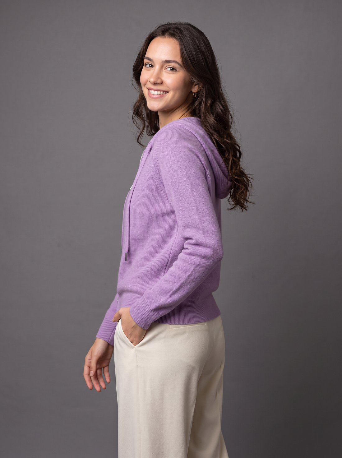 Woman wearing purple knit zip hoodie cardigan
