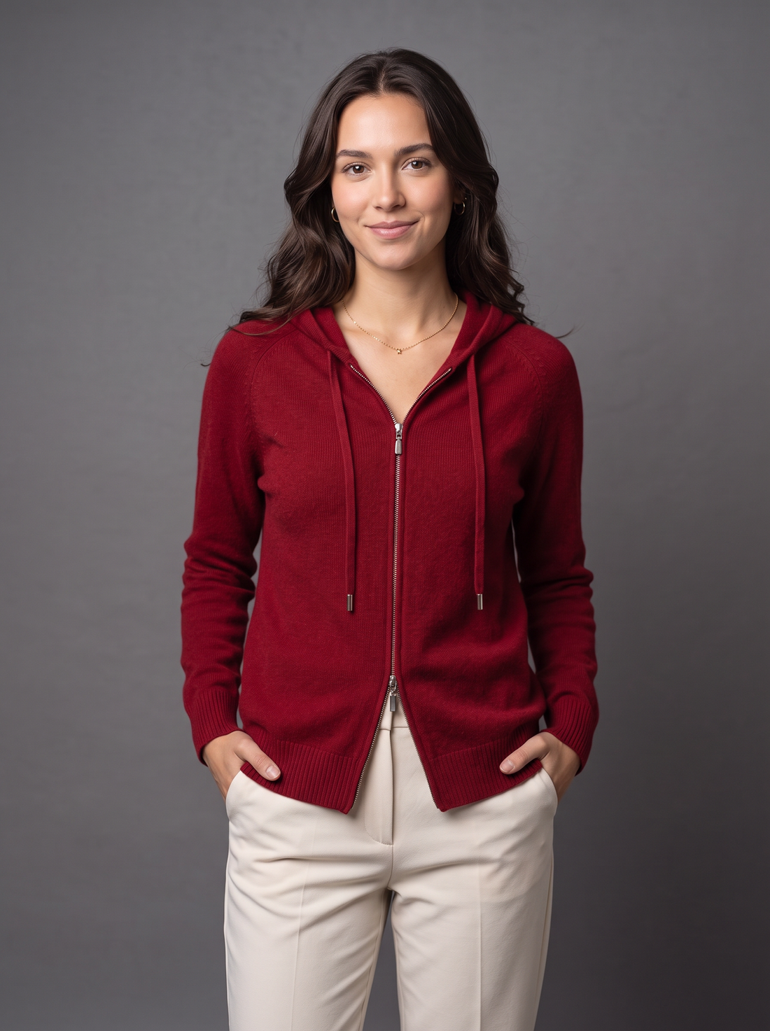 Woman wearing red knit zip hoodie cardigan