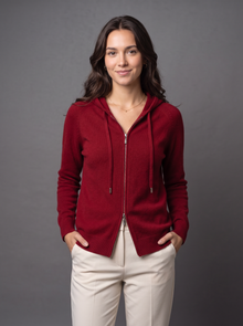 Woman wearing red knit zip hoodie cardigan
