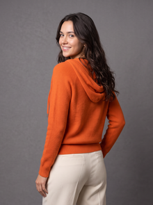 Orange knit zip hoodie cardigan, back view