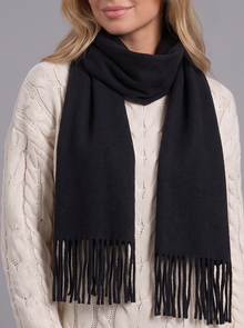 Woman wearing black tassel wrap scarf