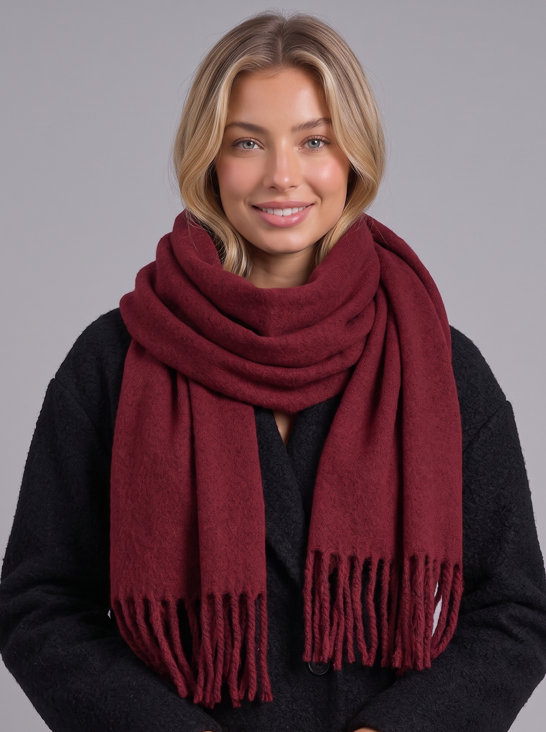 Woman wearing wine red tassel wrap scarf
