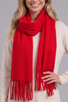 Woman wearing red tassel wrap scarf