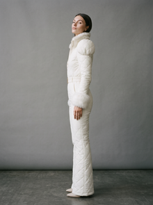 White quilted ski suit, side view