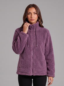 Purple teddy fleece zip jacket worn with black snow boots