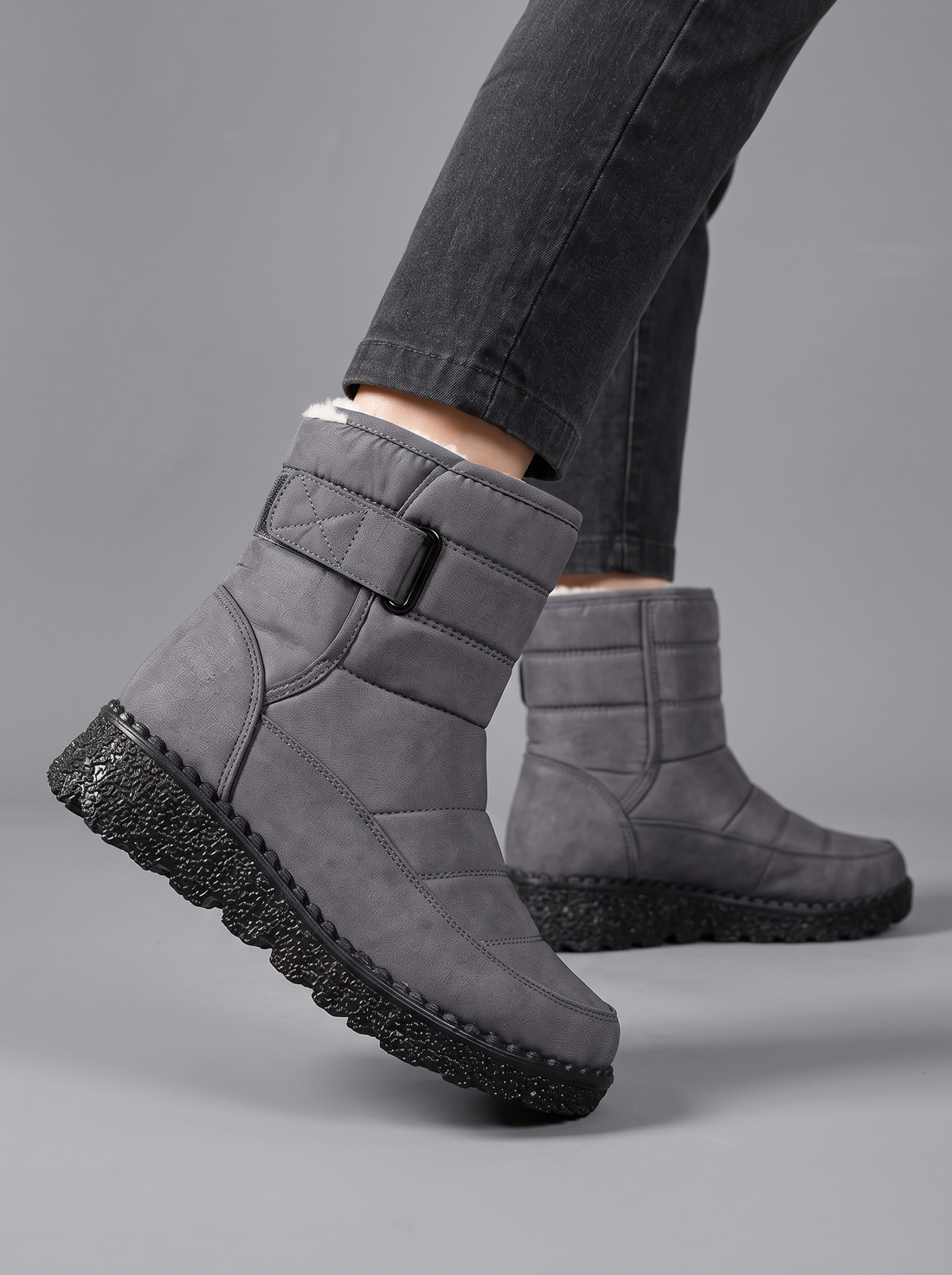 Grey quilted snow boots with velcro strap