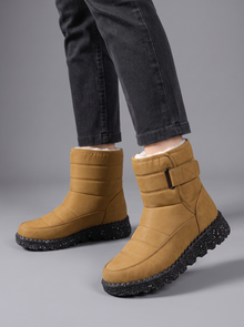 Tan quilted snow boots with velcro strap