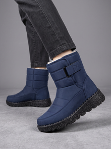 Navy quilted snow boots with velcro strap
