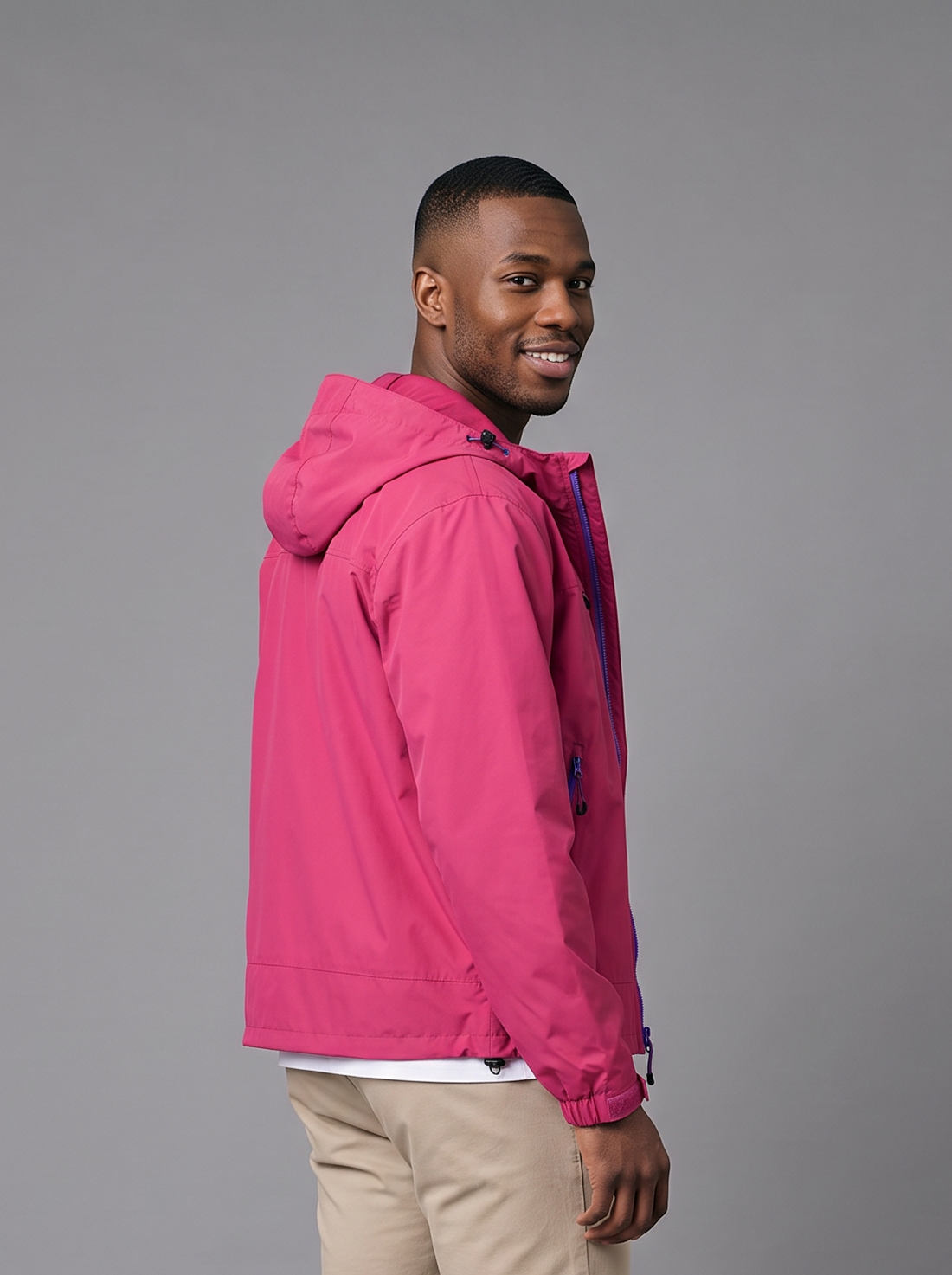 Pink hooded rain jacket seen from behind
