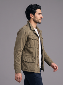 Side view of an army green multi-pocket field jacket