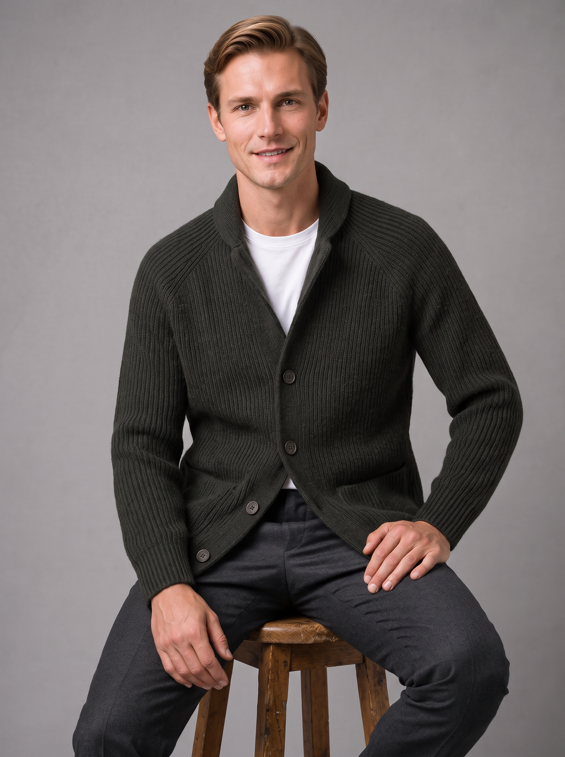 Man seated wearing charcoal ribbed knit collared cardigan