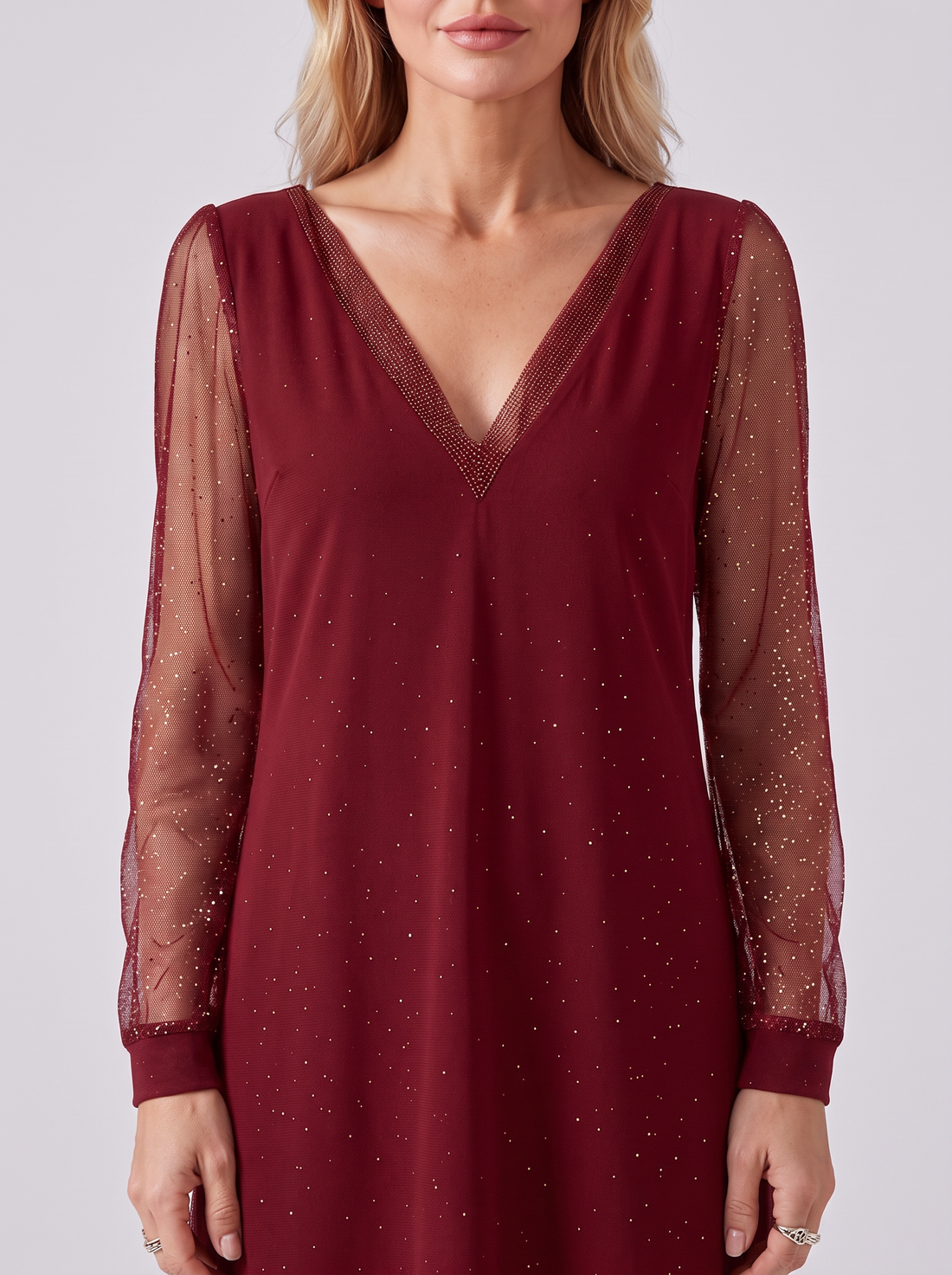 V neckline and glitter mesh sleeves – close-up