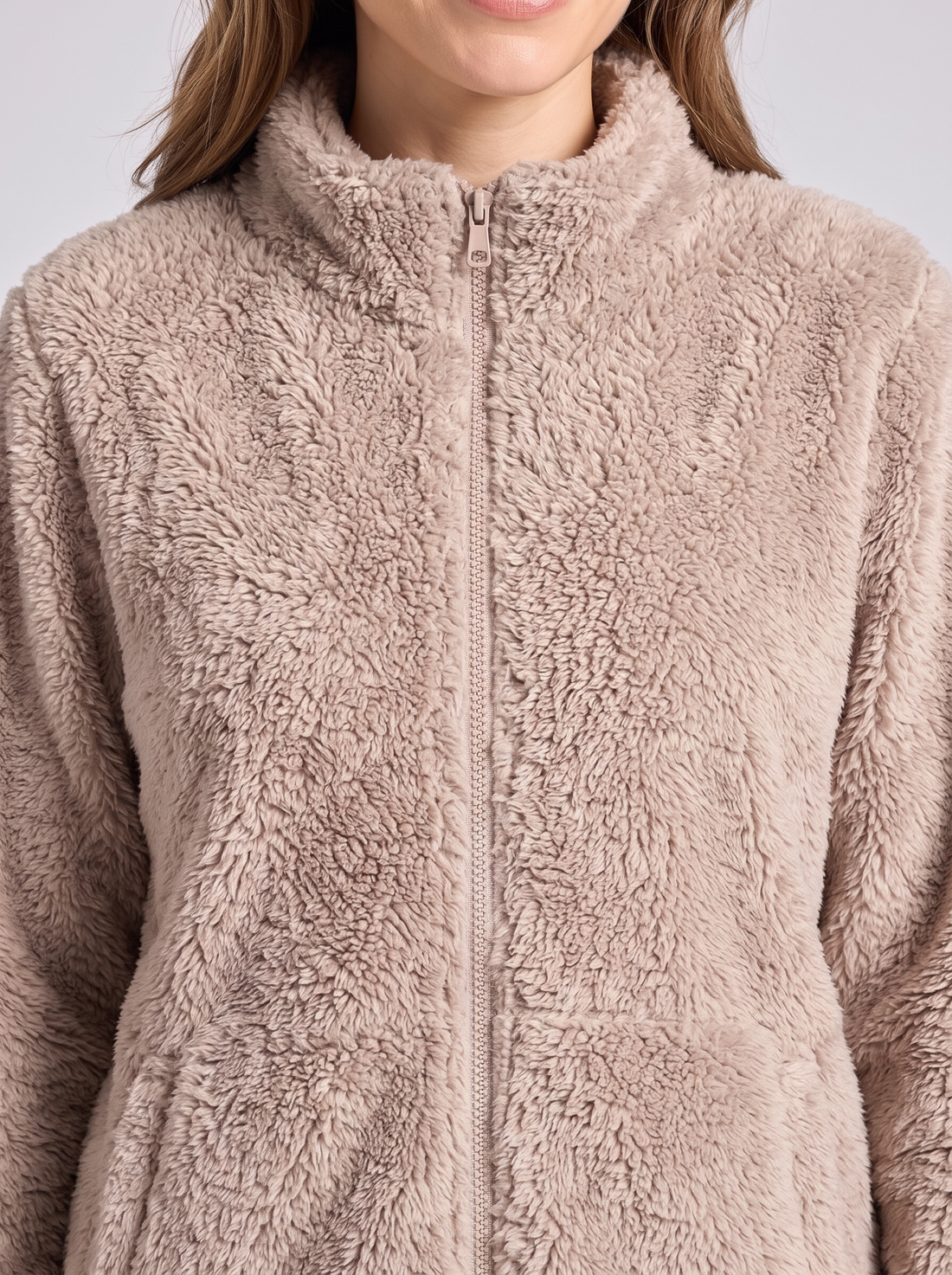 Fluffy sherpa texture and zip – close-up